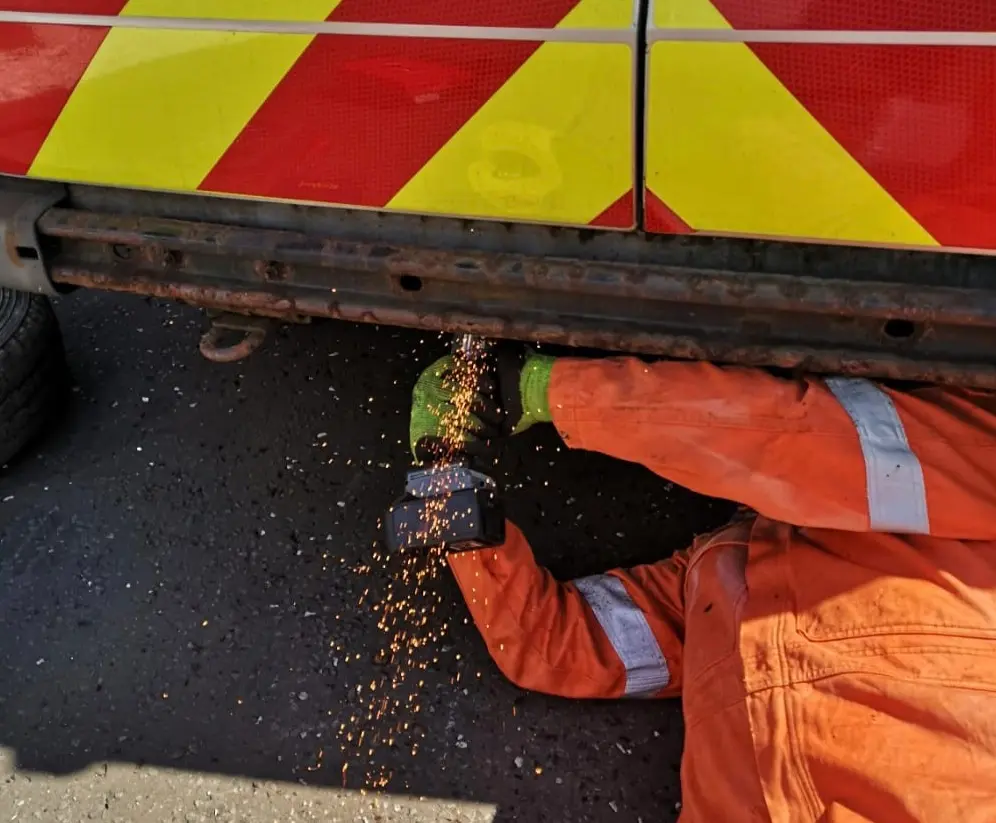 Grinding and welding repair work under van in Glasgow